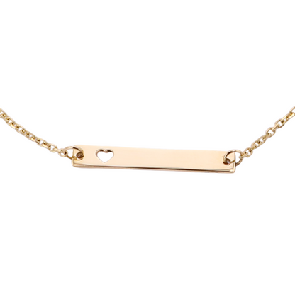 Gold necklace with a bar pendant featuring a heart cutout on a white background