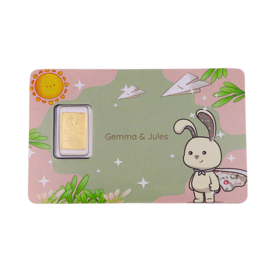 Gold bar in a decorative box with a cartoon rabbit and colorful design, featuring the brand 'Gemma & Jules'.