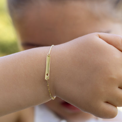 Gold bracelet on a child's in 14K Gold